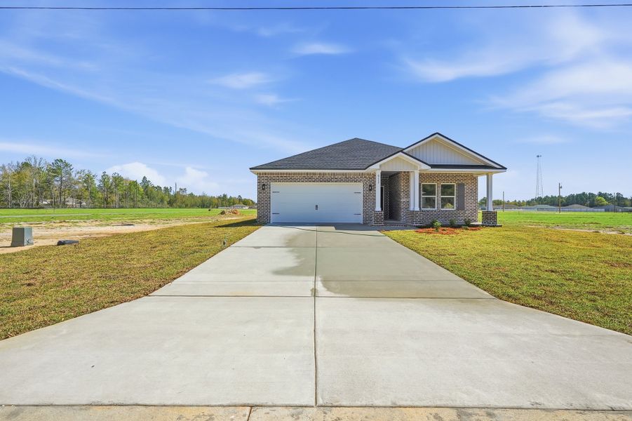 Front exterior of a new home in Southern Charm, Crestview, FL, highlighting curb appeal (Image 24).