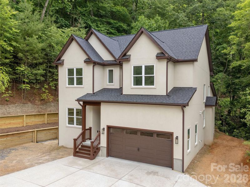 Front exterior of a new home in , Hendersonville, NC, highlighting curb appeal (Image 2). Front exterior of a new home in , Hendersonville, NC, highlighting curb appeal (Image 2).