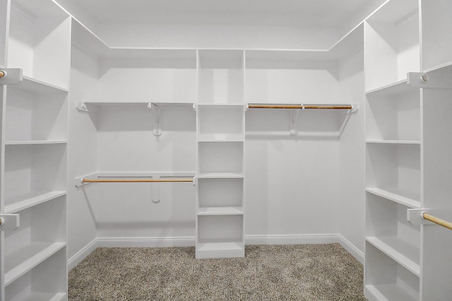 Spacious primary closet Spacious primary closet
