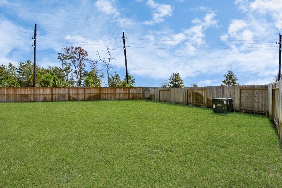 Backyard retreat, offering an abundance of space for kids to play and explore. The possibilities are endless in this outdoor haven, where the joy of open-air activities and family gatherings awaits. Backyard retreat, offering an abundance of space for kids to play and explore. The possibilities are endless in this outdoor haven, where the joy of open-air activities and family gatherings awaits.
