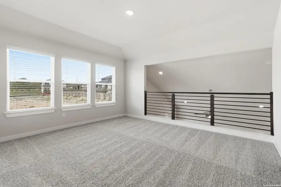 Spacious, unfurnished interior of a new home in Hunters Ranch, San Antonio (Image 15).