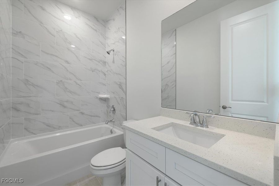 Bathroom featuring shower / bath combination and vanity Bathroom featuring shower / bath combination and vanity