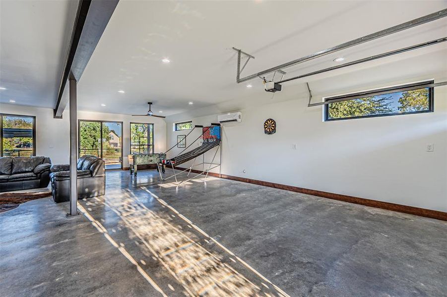 Garage featuring recessed lighting and ceiling fan