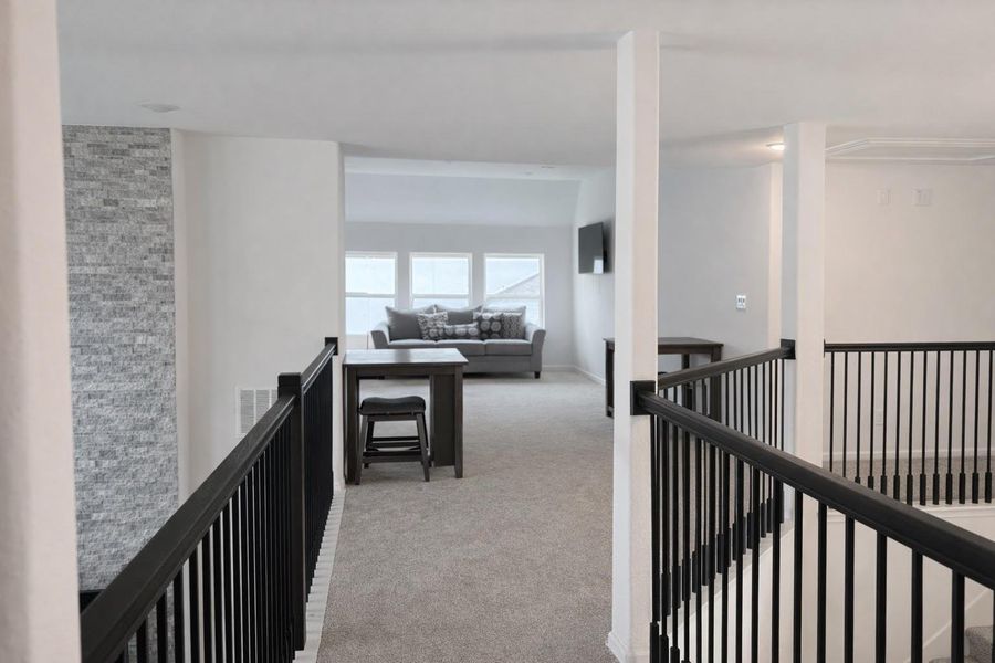 Ideal for gatherings, this inviting upstairs layout offers ample space and comfort.