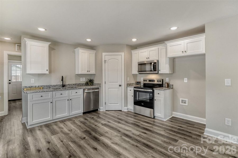 Spacious kitchen with stainless steel appliances Spacious kitchen with stainless steel appliances