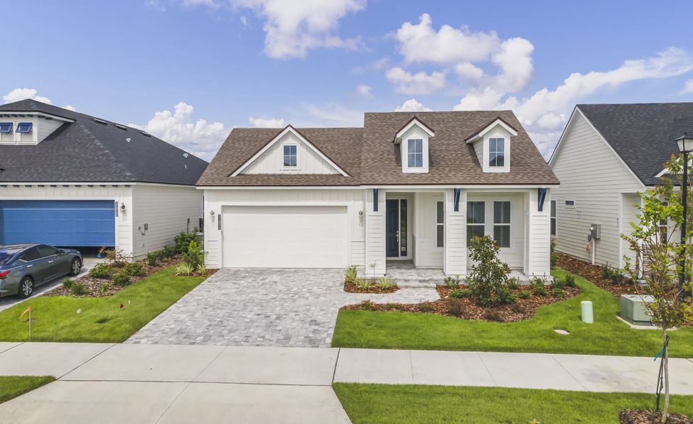 Front exterior of a new home in Oakmont, Gainesville, FL, highlighting curb appeal (Image 1).