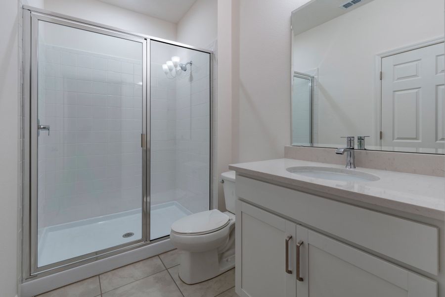 Multigenerational Modern Bathroom with Stylish Fixtures in Central Florida Home