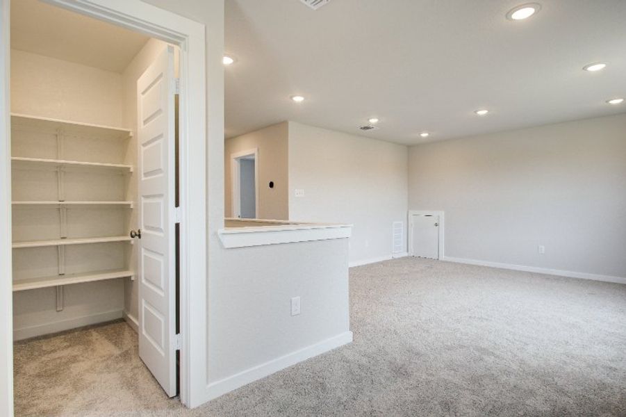 A room with a white shelf and a white cabinet. A room with a white shelf and a white cabinet.