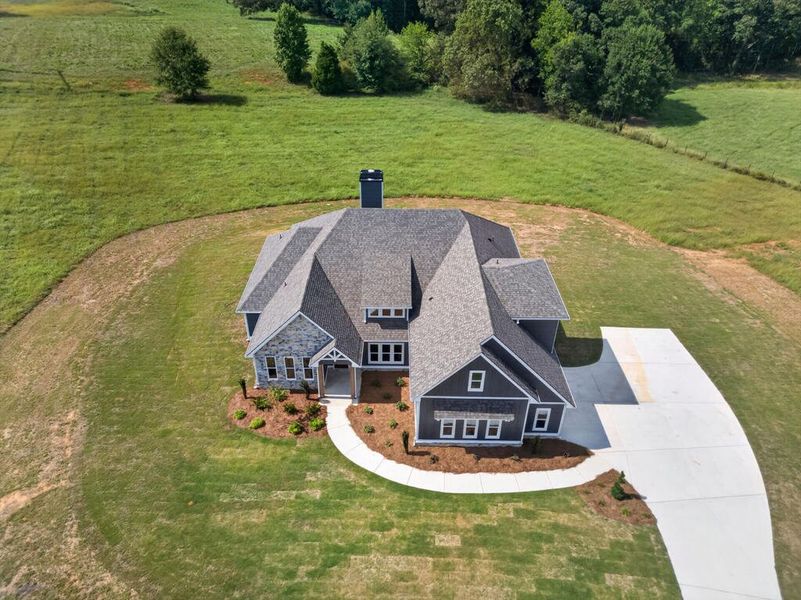 Front exterior of a new home in Veal Meadows, Roopville, GA, highlighting curb appeal (Image 28). Front exterior of a new home in Veal Meadows, Roopville, GA, highlighting curb appeal (Image 28).