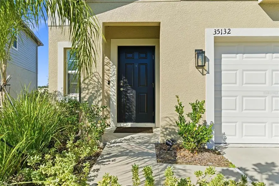 Exterior details and patio area of a home in Two Rivers, Zephyrhills (Image 3).