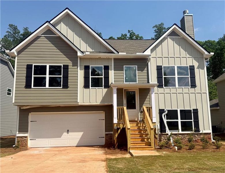 Front exterior of a new home in , Villa Rica, GA, highlighting curb appeal (Image 1). Front exterior of a new home in , Villa Rica, GA, highlighting curb appeal (Image 1).