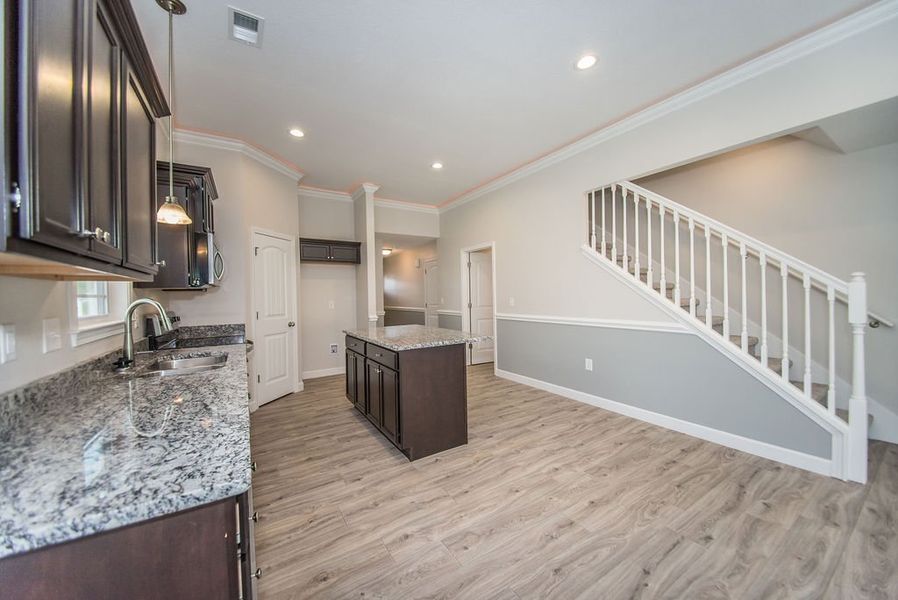Representative furnished interior of a home built from the Quincy by Enchanted Homes in Lonesome Dove, San Antonio (Image 15).