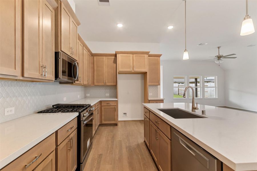 Furnished interior view inside a new home in Sunterra, Katy (Image 7).