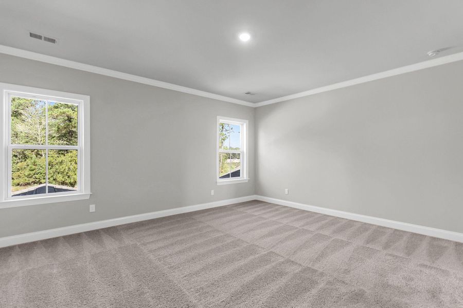 Spacious, unfurnished interior of a new home in Tidewater at Lakes of Cane Bay, Summerville (Image 29).