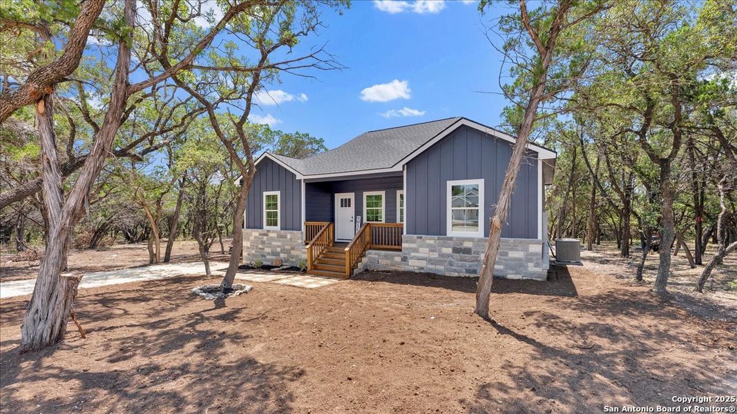 Front exterior of a new home in , Bandera, TX, highlighting curb appeal (Image 19). Front exterior of a new home in , Bandera, TX, highlighting curb appeal (Image 19).