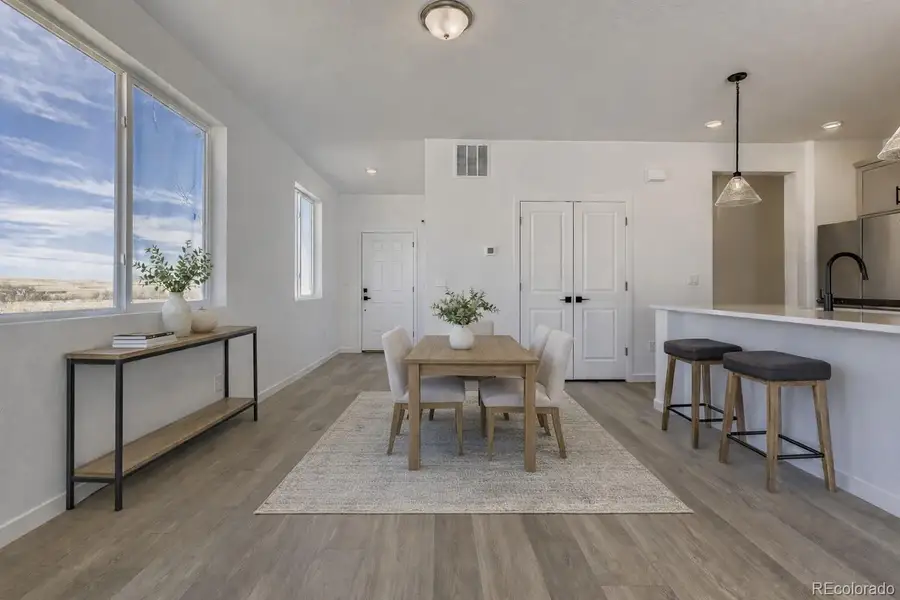 Virtually Staged Dining Area/Entry Virtually Staged Dining Area/Entry