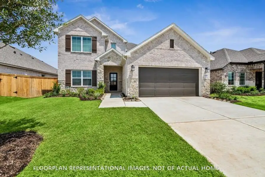 Front exterior of a new home in Magnolia Ridge, Magnolia, TX, highlighting curb appeal (Image 2). Front exterior of a new home in Magnolia Ridge, Magnolia, TX, highlighting curb appeal (Image 2).