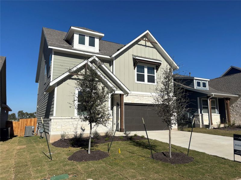 Front exterior of a new home in Cannon Ranch 45s, Dripping Springs, TX, highlighting curb appeal (Image 24).