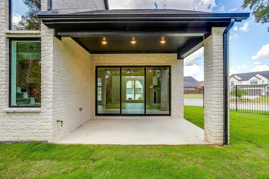 Exterior details and patio area of a home in St. Joseph Estates, North Richland Hills (Image 25).