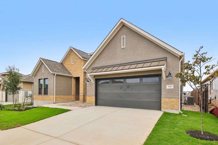 Front exterior of a new home in Easton Park, Austin, TX, highlighting curb appeal (Image 2). Front exterior of a new home in Easton Park, Austin, TX, highlighting curb appeal (Image 2).