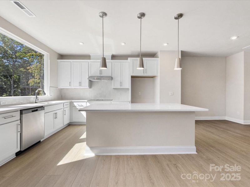 Designer Pendant Lighting Perfectly Paired with Brushed Nickle Hardware