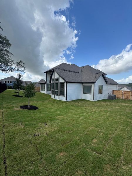 Front exterior of a new home in Headwaters, Dripping Springs, TX, highlighting curb appeal (Image 17). Front exterior of a new home in Headwaters, Dripping Springs, TX, highlighting curb appeal (Image 17).