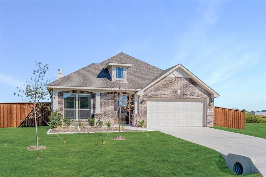 Front exterior of a new home in Wildcat Ridge Phase 3, Godley, TX, highlighting curb appeal (Image 23). Front exterior of a new home in Wildcat Ridge Phase 3, Godley, TX, highlighting curb appeal (Image 23).