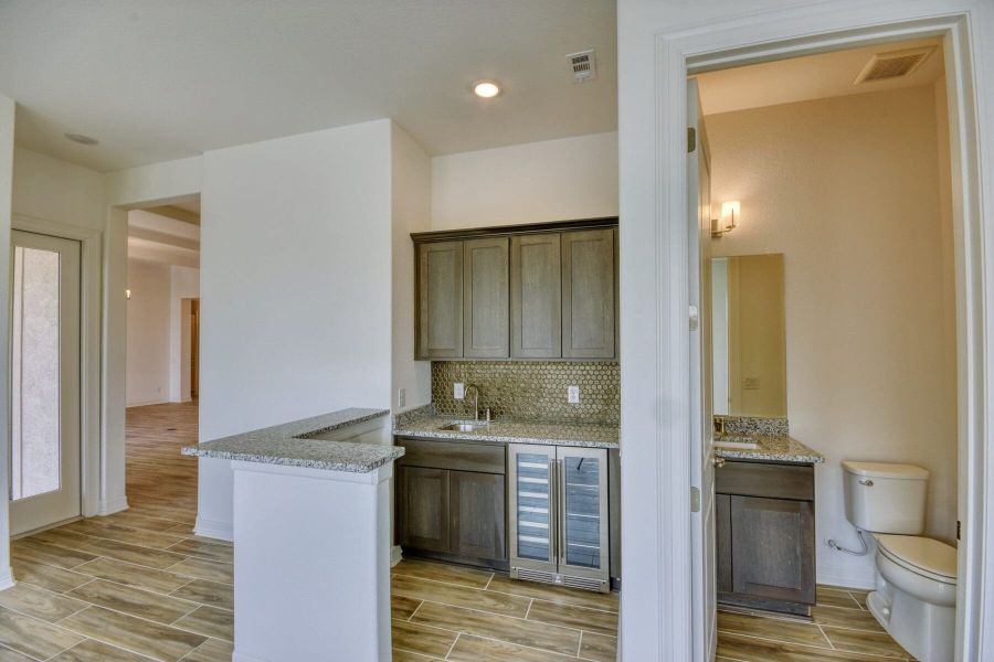 Furnished interior view inside a new home in El Sonido at Campanas, San Antonio (Image 8).