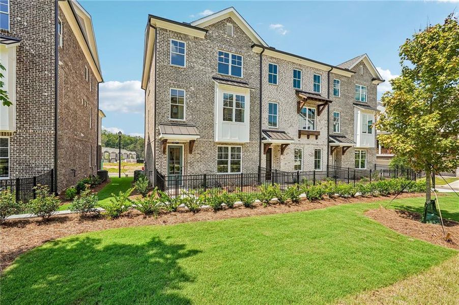 Front exterior of a new home in Waterside Townhomes, Peachtree Corners, GA, highlighting curb appeal (Image 19).