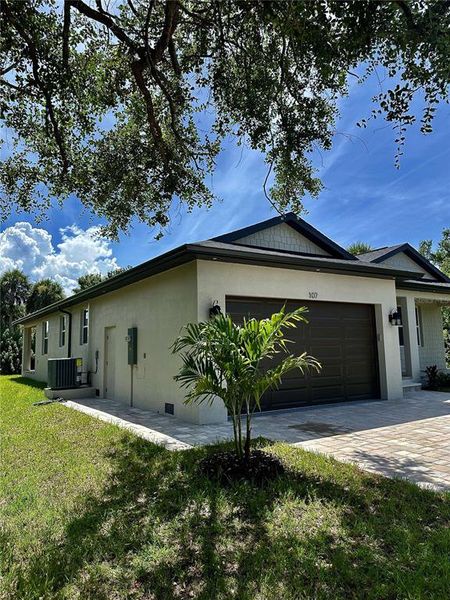 Front exterior of a new home in , Rotonda West, FL, highlighting curb appeal (Image 18).