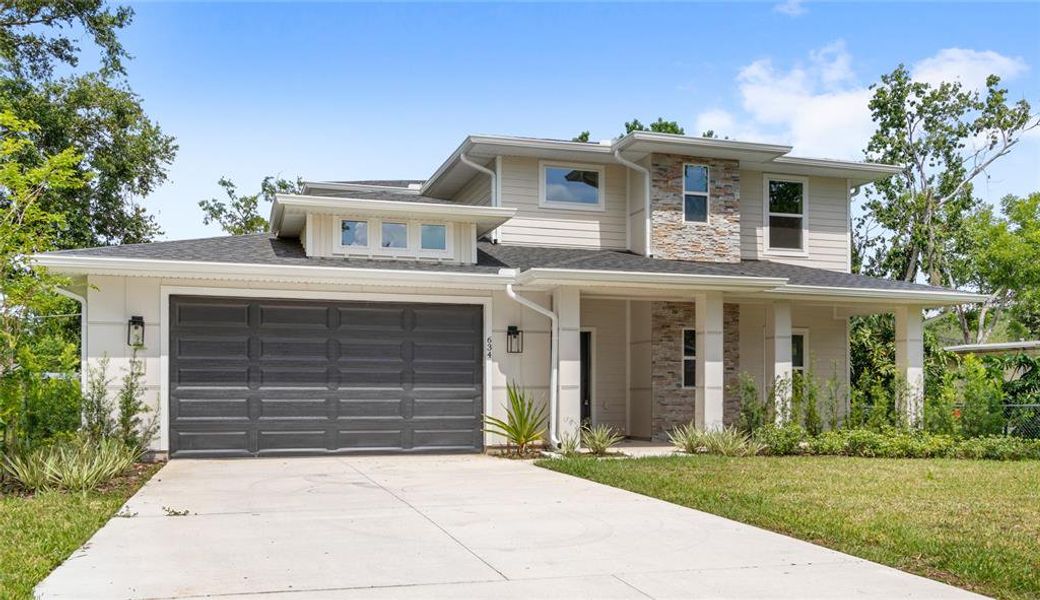 Front exterior of a new home in , Winter Garden, FL, highlighting curb appeal (Image 27).