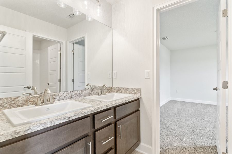 Representative furnished interior of a home built from the 2705 by Adams Homes in Winding Oaks, Weeki Wachee (Image 10).