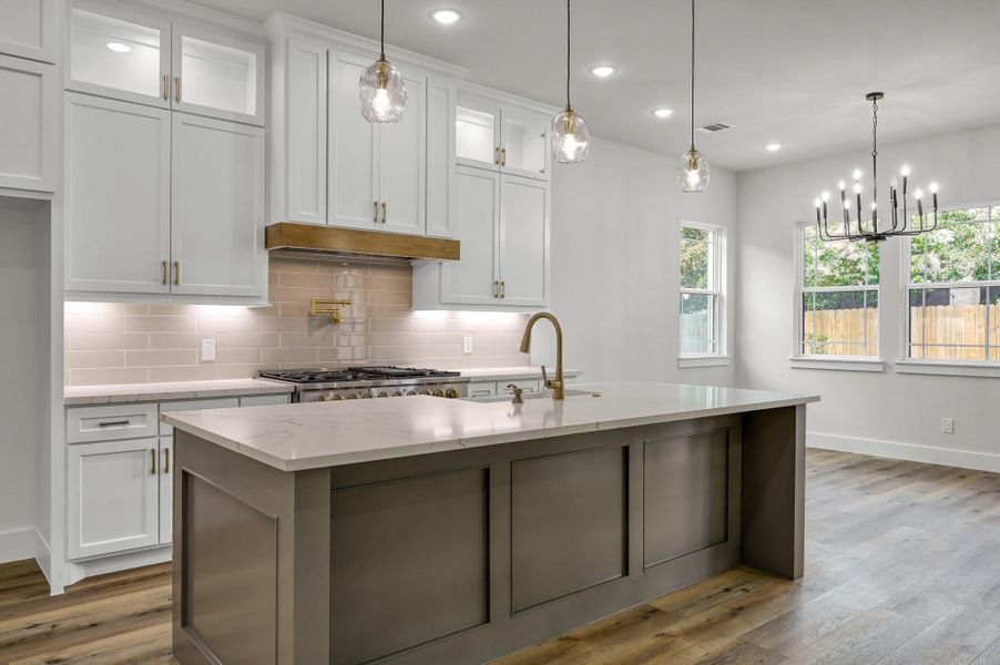Pull up a stool and enjoy breakfast at the large kitchen island. Pull up a stool and enjoy breakfast at the large kitchen island.