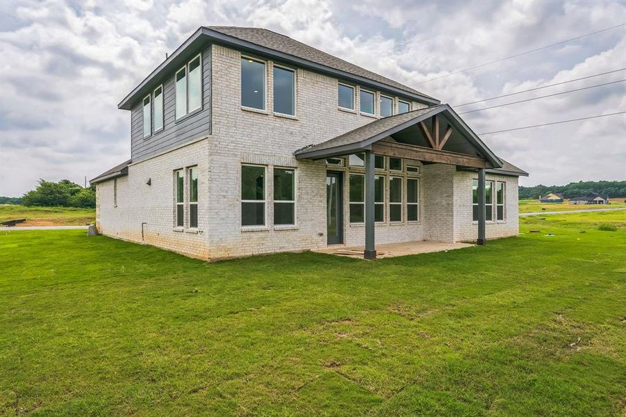Exterior details and patio area of a home in Eagle Estates, Cross Timber (Image 3).