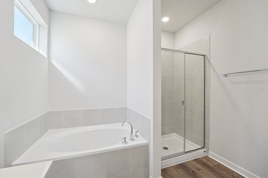 A bathroom with a glass shower.