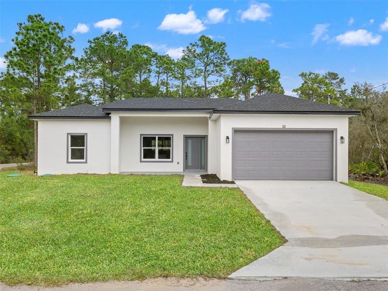 Front exterior of a new home in , Ocklawaha, FL, highlighting curb appeal (Image 19).
