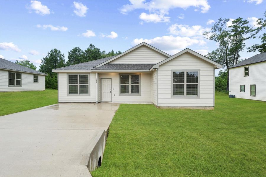 Front exterior of a new home in , Lufkin, TX, highlighting curb appeal (Image 1).
