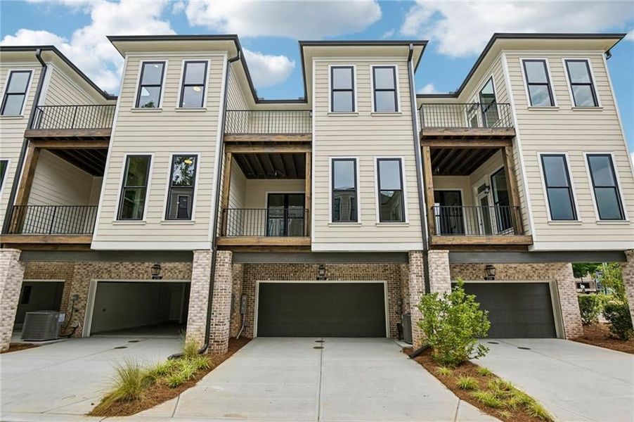 Front exterior of a new home in Byers Park, Alpharetta, GA, highlighting curb appeal (Image 2). Front exterior of a new home in Byers Park, Alpharetta, GA, highlighting curb appeal (Image 2).