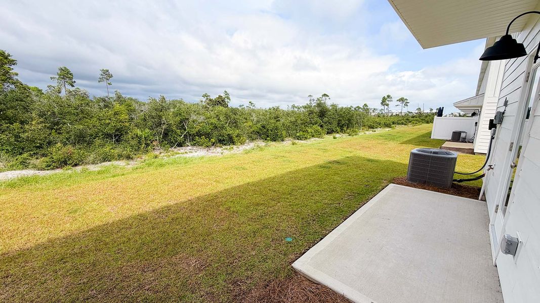 Exterior details and patio area of a home in Salt Creek Townhomes at Mexico Beach, Mexico Beach (Image 17).