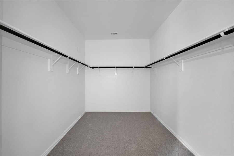 Walk in closet with light carpet Walk in closet with light carpet