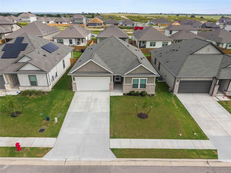 An inviting facade with an attached garage and neat landscaping defines this contemporary residence. An inviting facade with an attached garage and neat landscaping defines this contemporary residence.