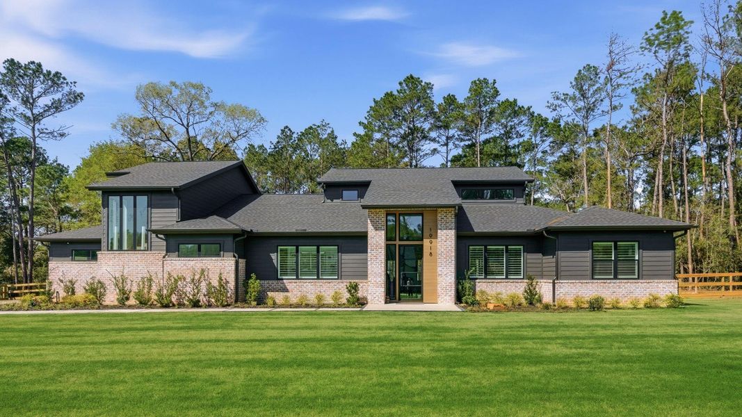 Front exterior of a new home in , Magnolia, TX, highlighting curb appeal (Image 22).