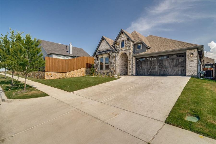 Front exterior of a new home in Parks of Aledo, Aledo, TX, highlighting curb appeal (Image 1). Front exterior of a new home in Parks of Aledo, Aledo, TX, highlighting curb appeal (Image 1).