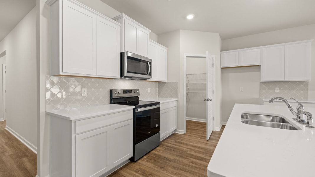 Furnished interior view inside a new home in Oakchase at Hampton, Hampton (Image 5).