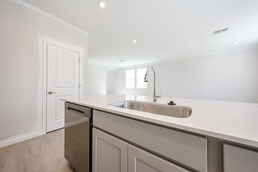 A kitchen with white cabinets. A kitchen with white cabinets.