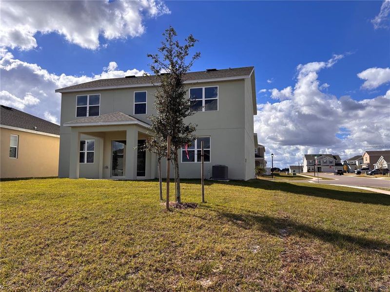 Exterior details and patio area of a home in Trinity Lakes, Groveland (Image 4).