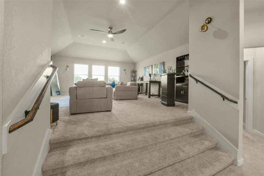 Large upstairs game room ideal for entertainment and recreation.