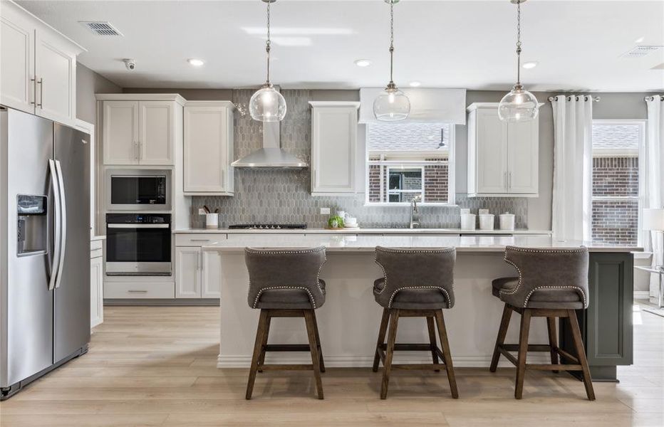 *Model Representation - Spacious kitchen with eat-in bartop island