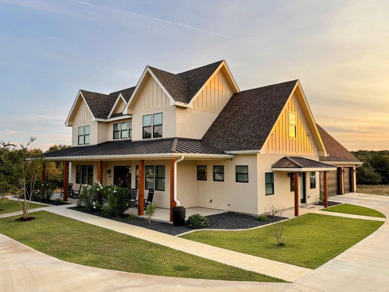 Front exterior of a new home in , New Braunfels, TX, highlighting curb appeal (Image 2). Front exterior of a new home in , New Braunfels, TX, highlighting curb appeal (Image 2).