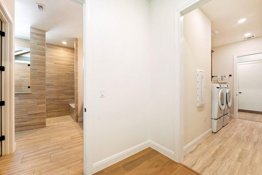 Functional laundry facilities and a spacious shower offer practical convenience in this well-appointed home. Functional laundry facilities and a spacious shower offer practical convenience in this well-appointed home.